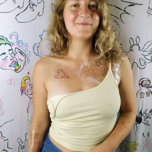 line-art tattoo of a humorous creature